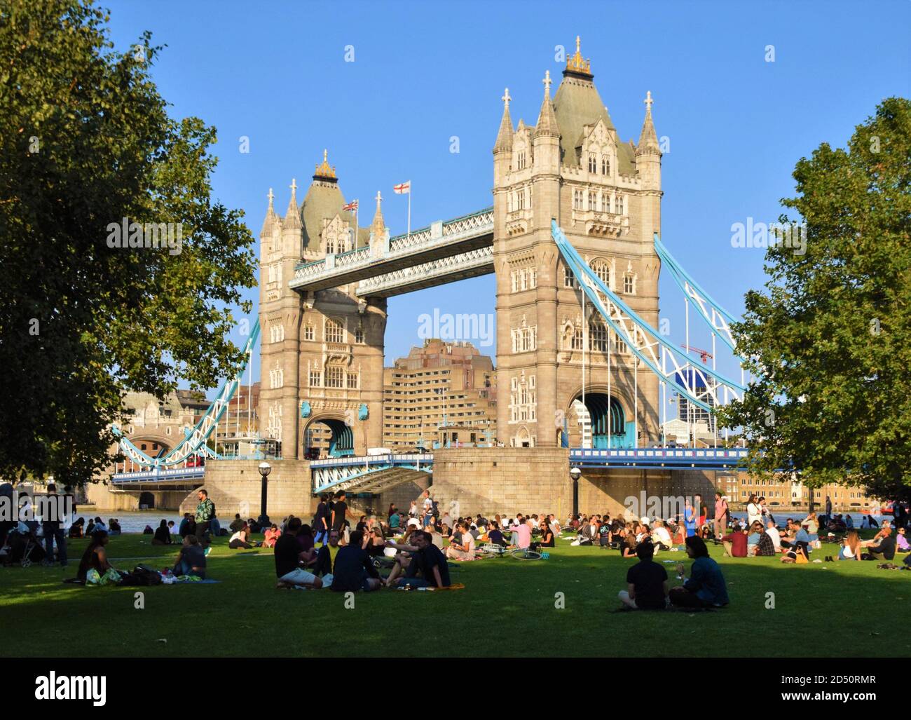 People in Potters Fields Park next to Tower Bridge, with social ...