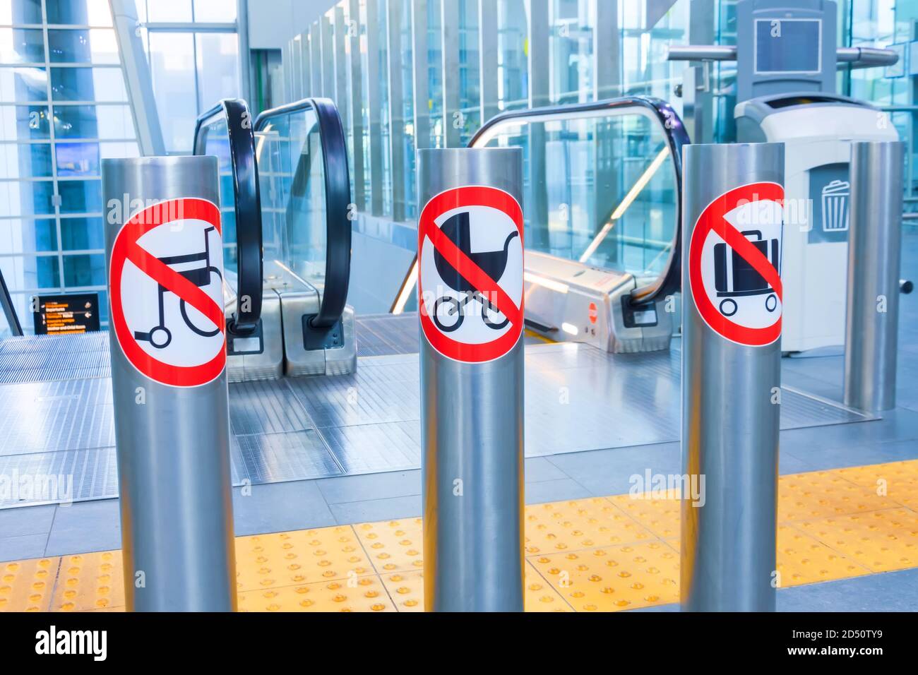Prohibition signs for luggage, suitcases, carts and baby carriages on an escalator in a public building Stock Photo