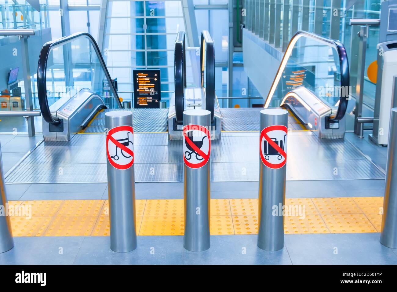 Prohibition signs for luggage, suitcases, carts and baby carriages on an escalator in a public building Stock Photo