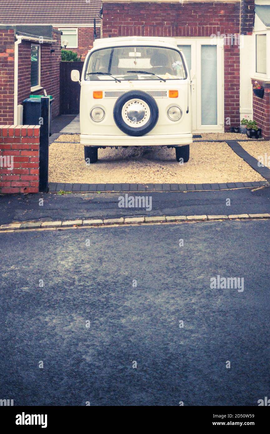 Classic vintage Volkswagen camper van in the driveway of a house in Consett, County Durham, UK Stock Photo