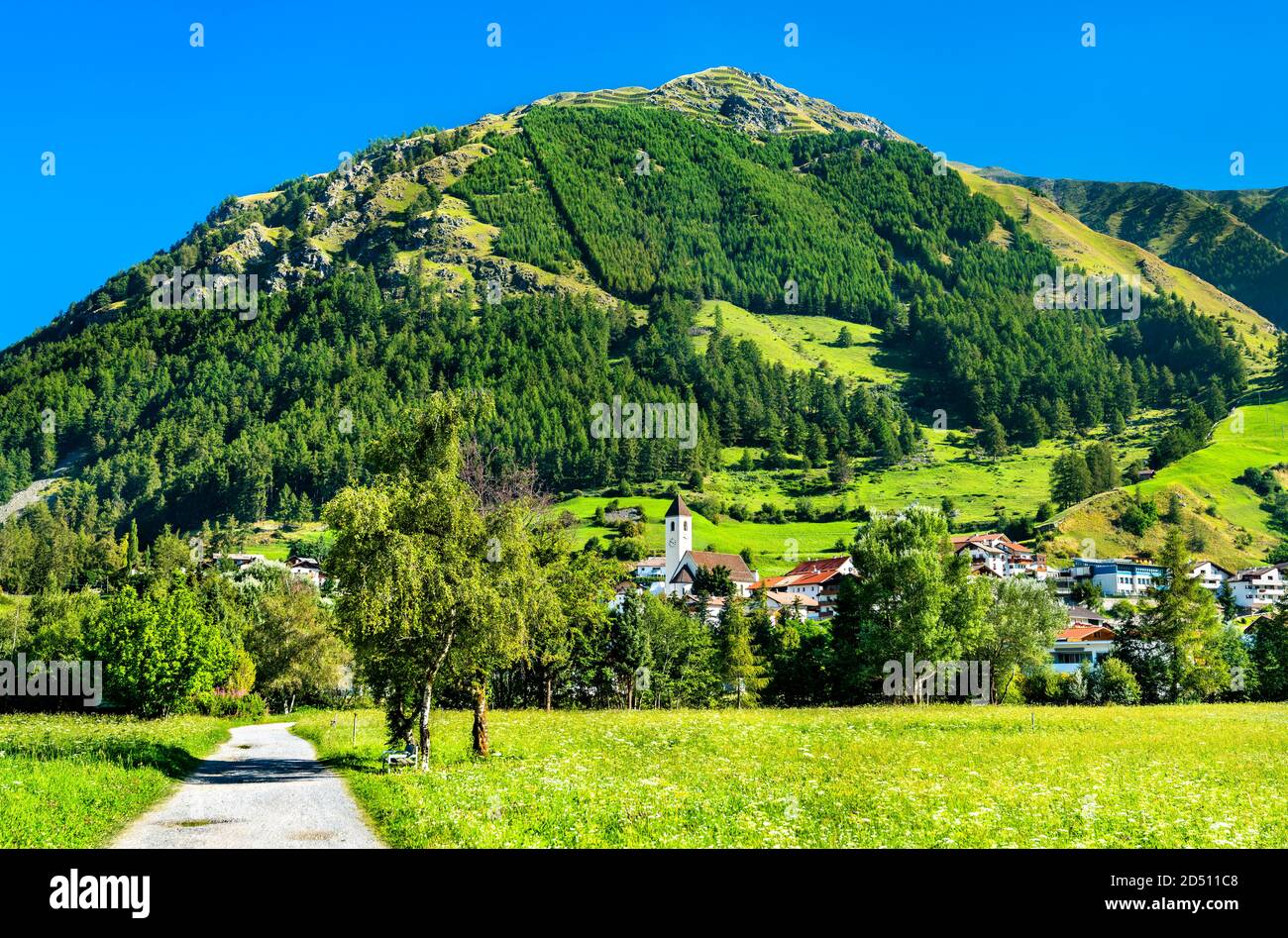 Graun im Vinschgau or Curon Venosta, a town on Lake Reschen in South Tyrol, Italy Stock Photo
