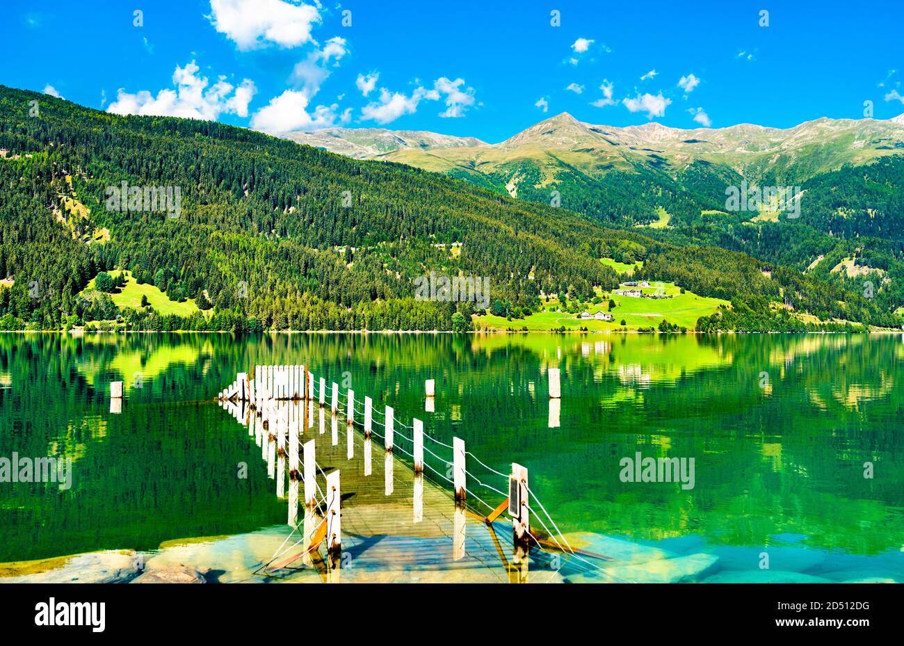 Pier at Reschensee, an artificial lake in the Italian Alps Stock Photo