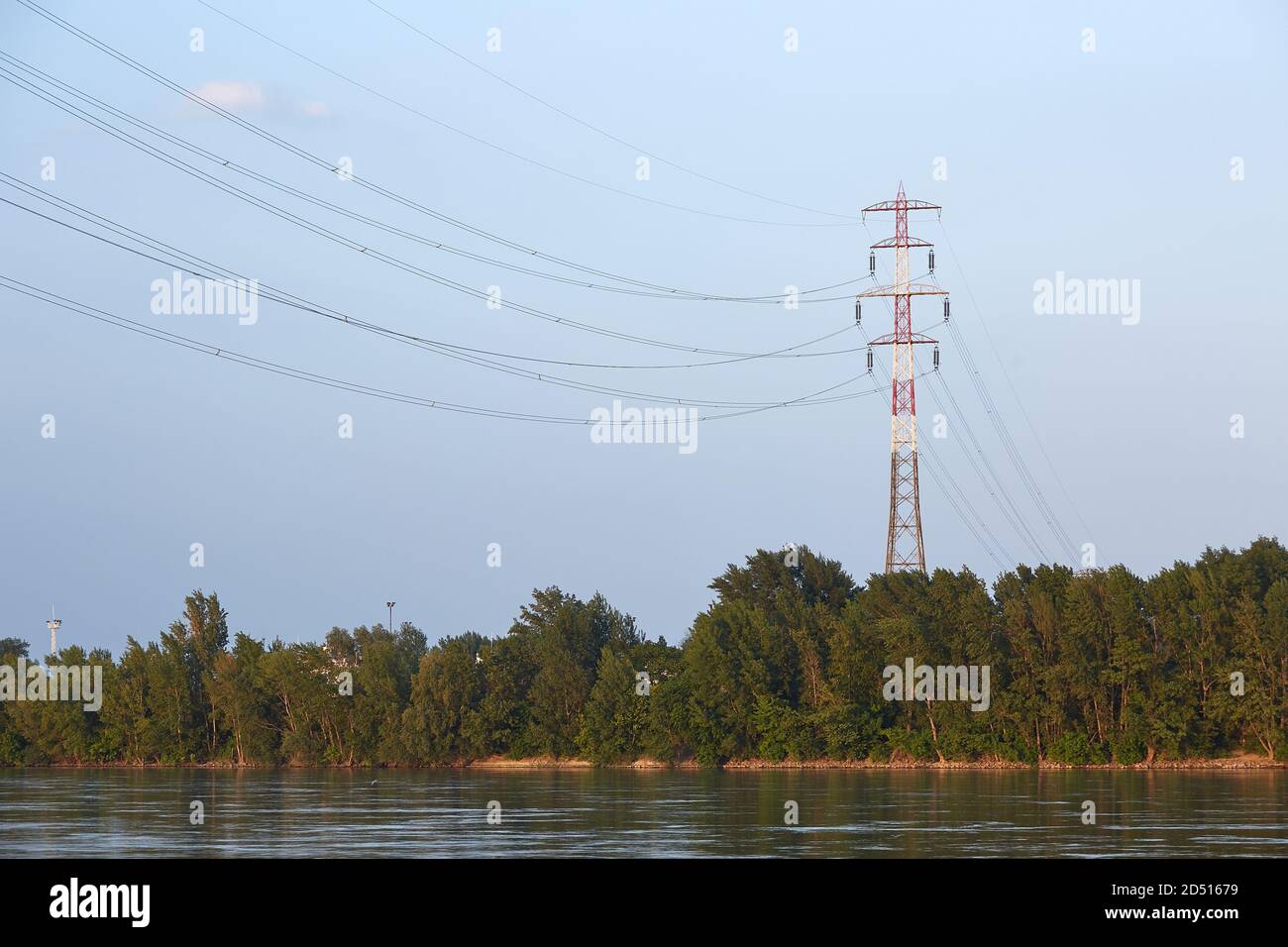 Electric lines over river Stock Photo Alamy