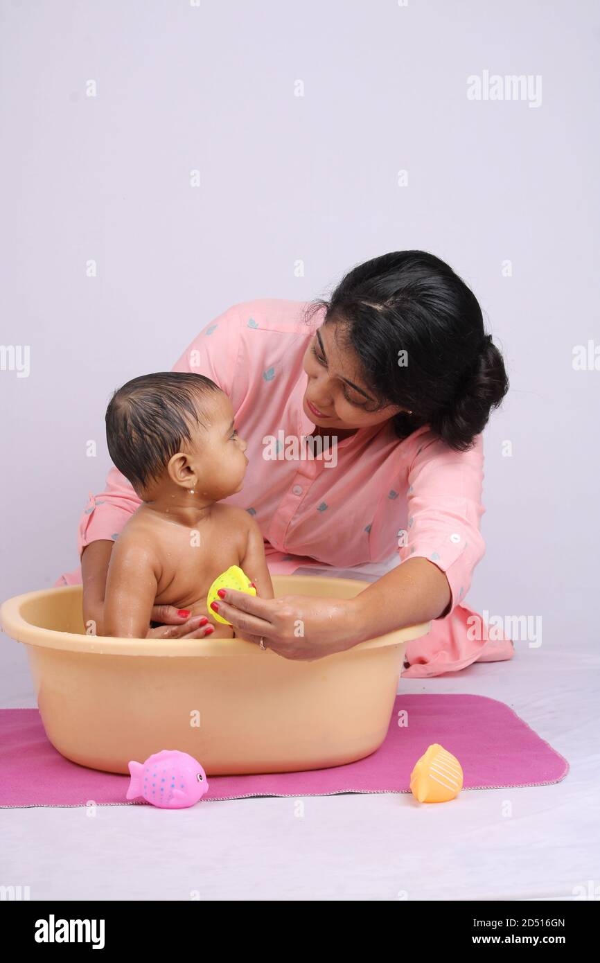 Indian Mom Bathing Baby Paintings