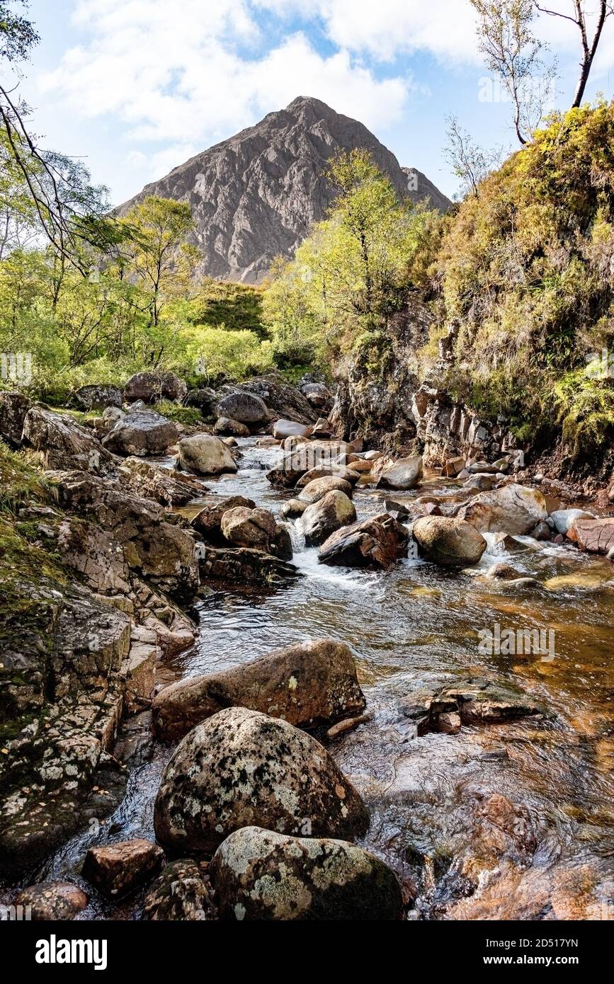 Buachaille Etive Mòr, a mountain at the head of Glen Etive in the Highlands of Scotland. picture shows the stream with the mountain in the background Stock Photo