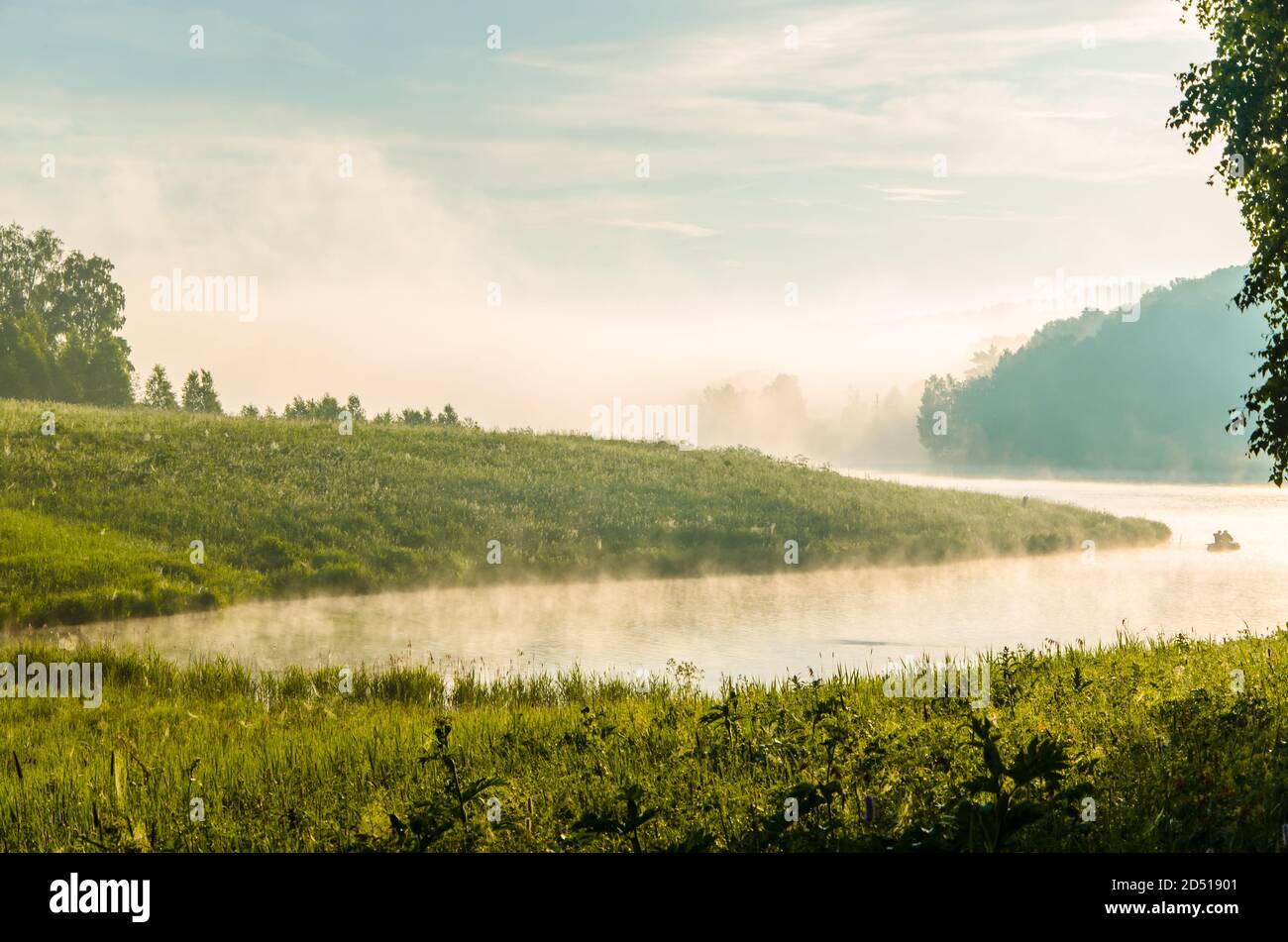 thick morning fog in the summer forest near the reservoir Stock Photo ...