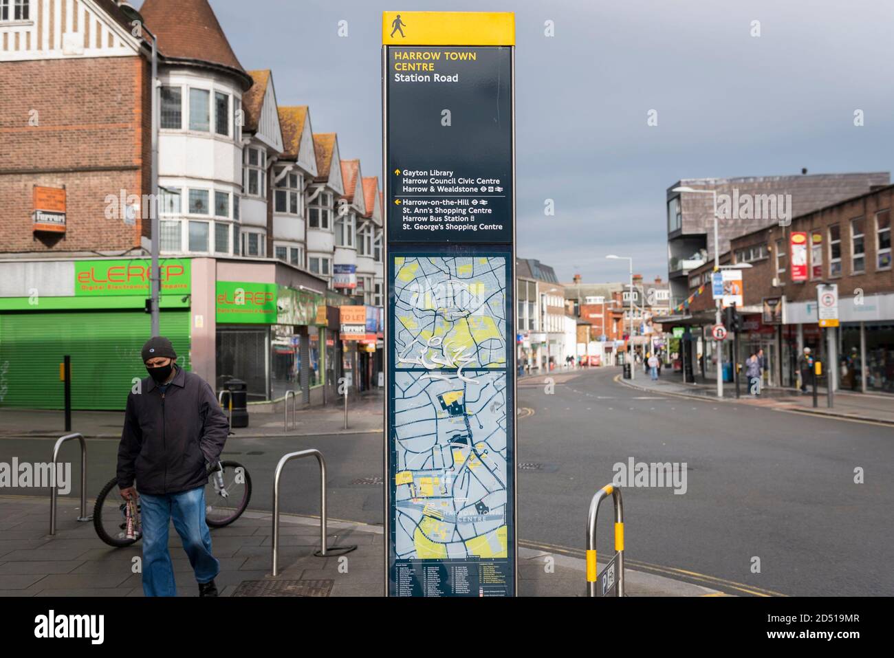 Station Road Harrow Street View London, Uk. 12 October 2020. A Man Wearing A Facemask Walks By A Street Map  In Harrow Town Centre. It Is Reported That Five London Boroughs Had More  Than 100 New Covid-19