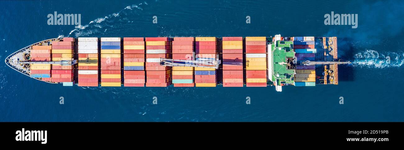 Container cargo ship, logistics, import export business. Water transport, international freight shipping, commercial trade and transportation in the o Stock Photo