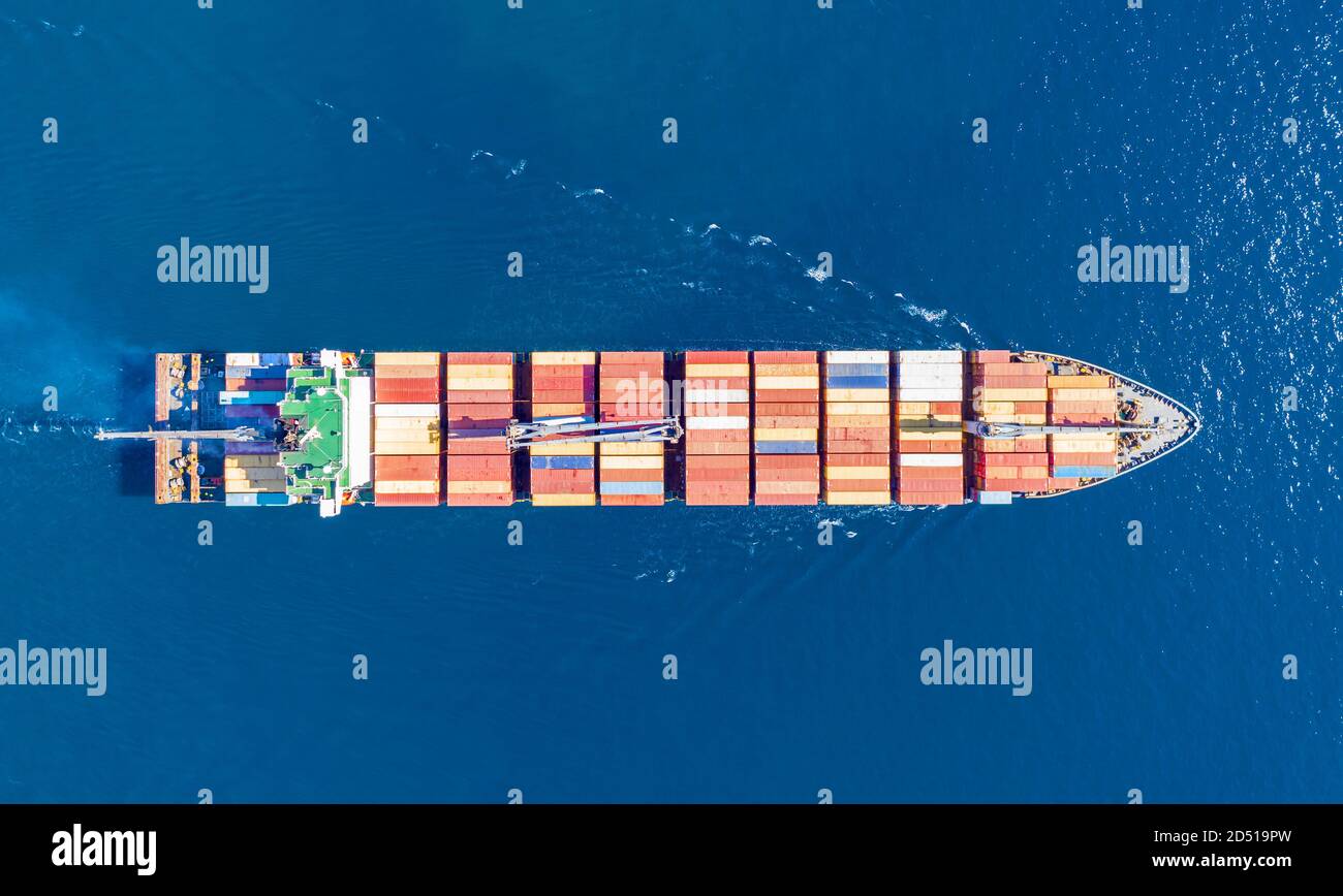Container cargo ship, import export business and logistics, aerial top view. Water transport, international freight shipping, commercial trade and tra Stock Photo