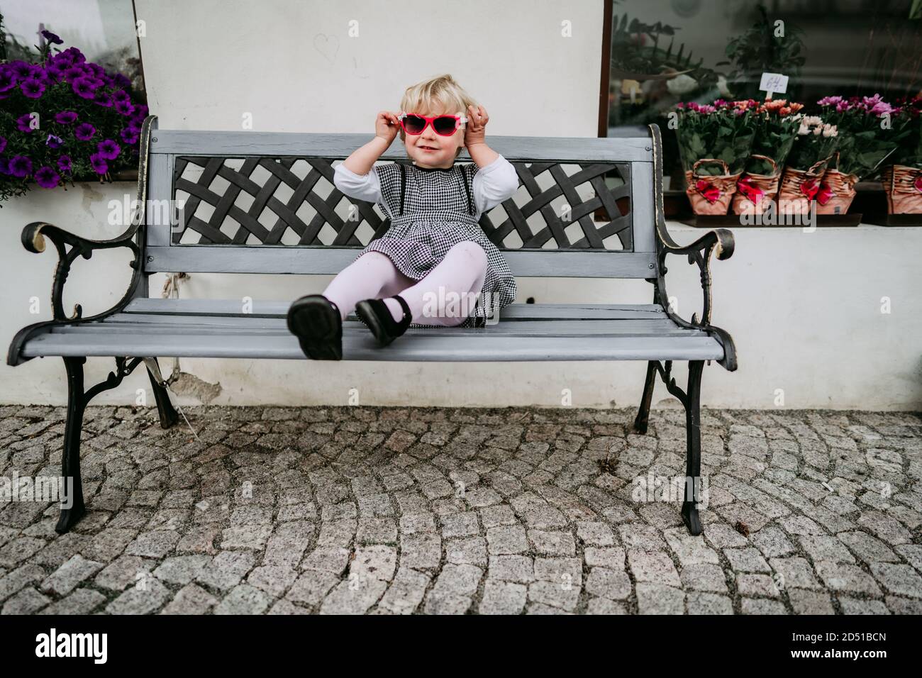 Sad girl sitting on bench hi-res stock photography and images - Alamy