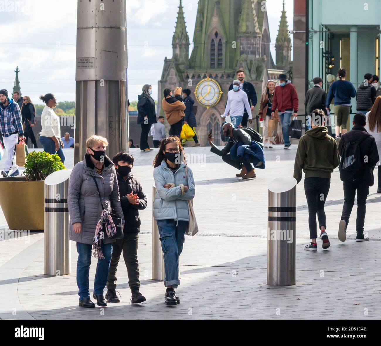 Crowds of people wearing facemasks in Birmingham City Centre as the city and country go into another series of stricter lockdown measures Stock Photo