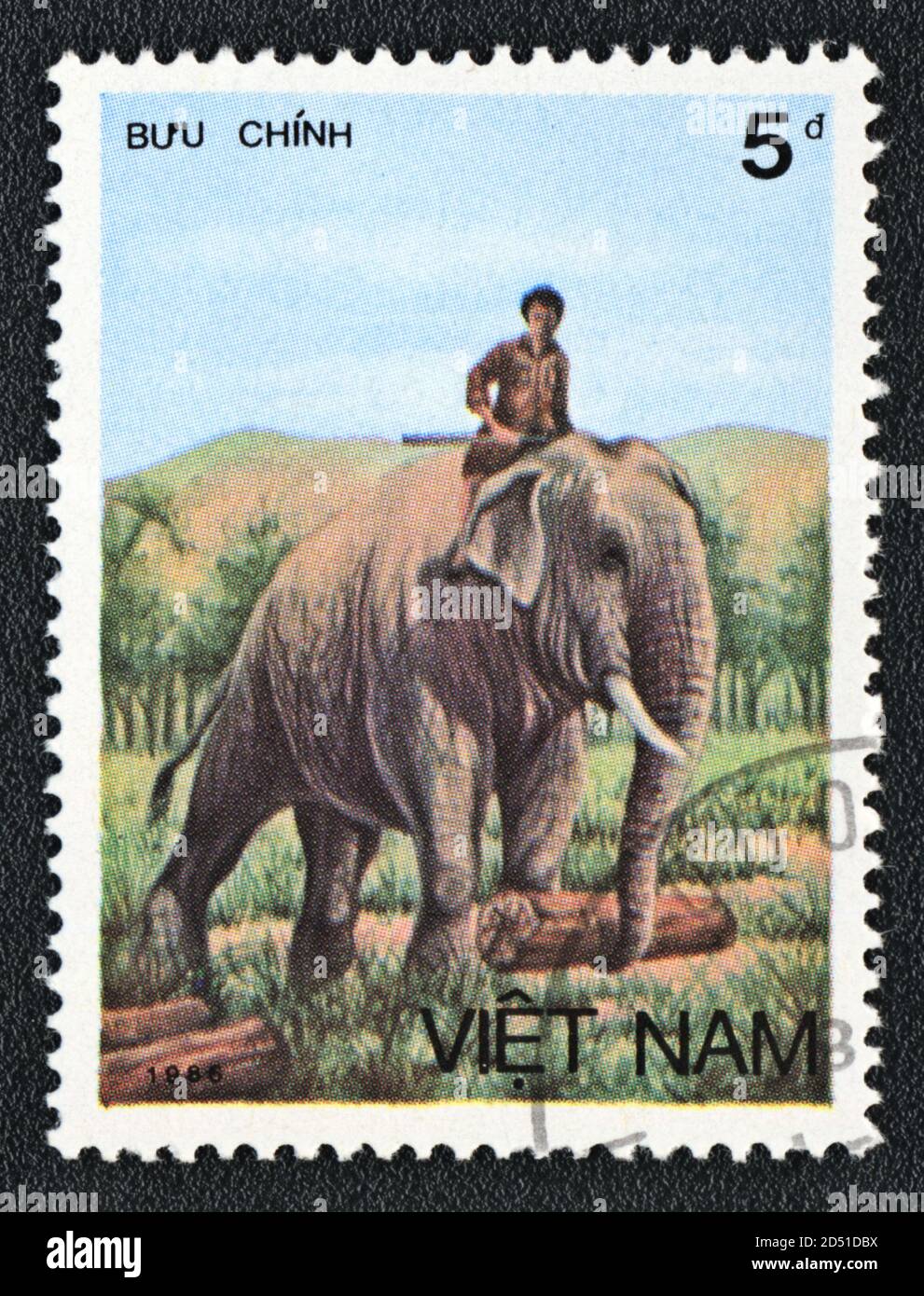 Postage stamp. Asian elephants, Man and worker  elephant, series,  Vietnam, 1986 Stock Photo