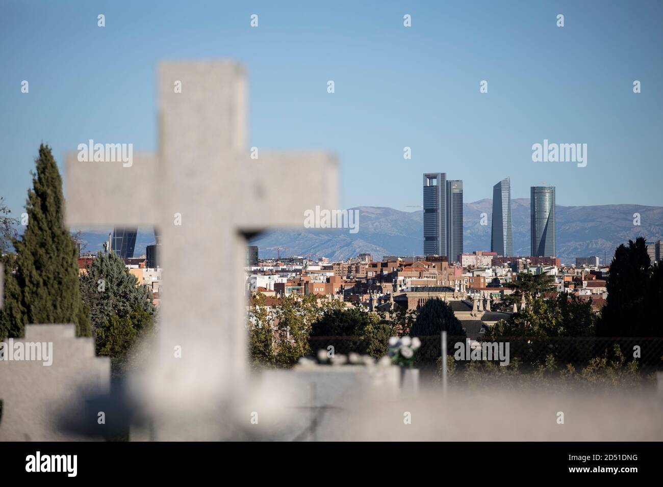 Madrid, Spain. 12th Oct, 2020. View from Almudena cemetery to the Cuatro Torres Business Area, a complex of skyscrapers and a symbol of Madrid's economic life, on the Spanish National Day. Spain is currently struggling with a particularly violent second wave of corona and has the highest infection rates in Western Europe. Credit: Javier Carbajal/dpa/Alamy Live News Stock Photo