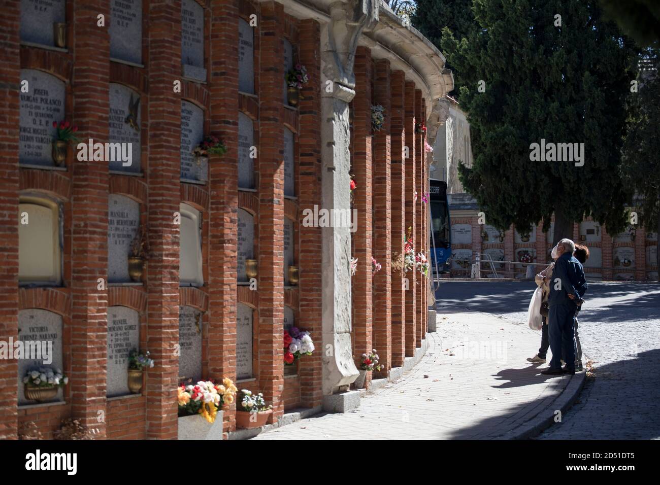 Madrid, Spain. 12th Oct, 2020. Visitors stand in the Almudena cemetery on the Spanish National Day. Spain is currently struggling with a particularly violent second wave of corona and has the highest infection rates in Western Europe.Spain Credit: Javier Carbajal/dpa/Alamy Live News Stock Photo