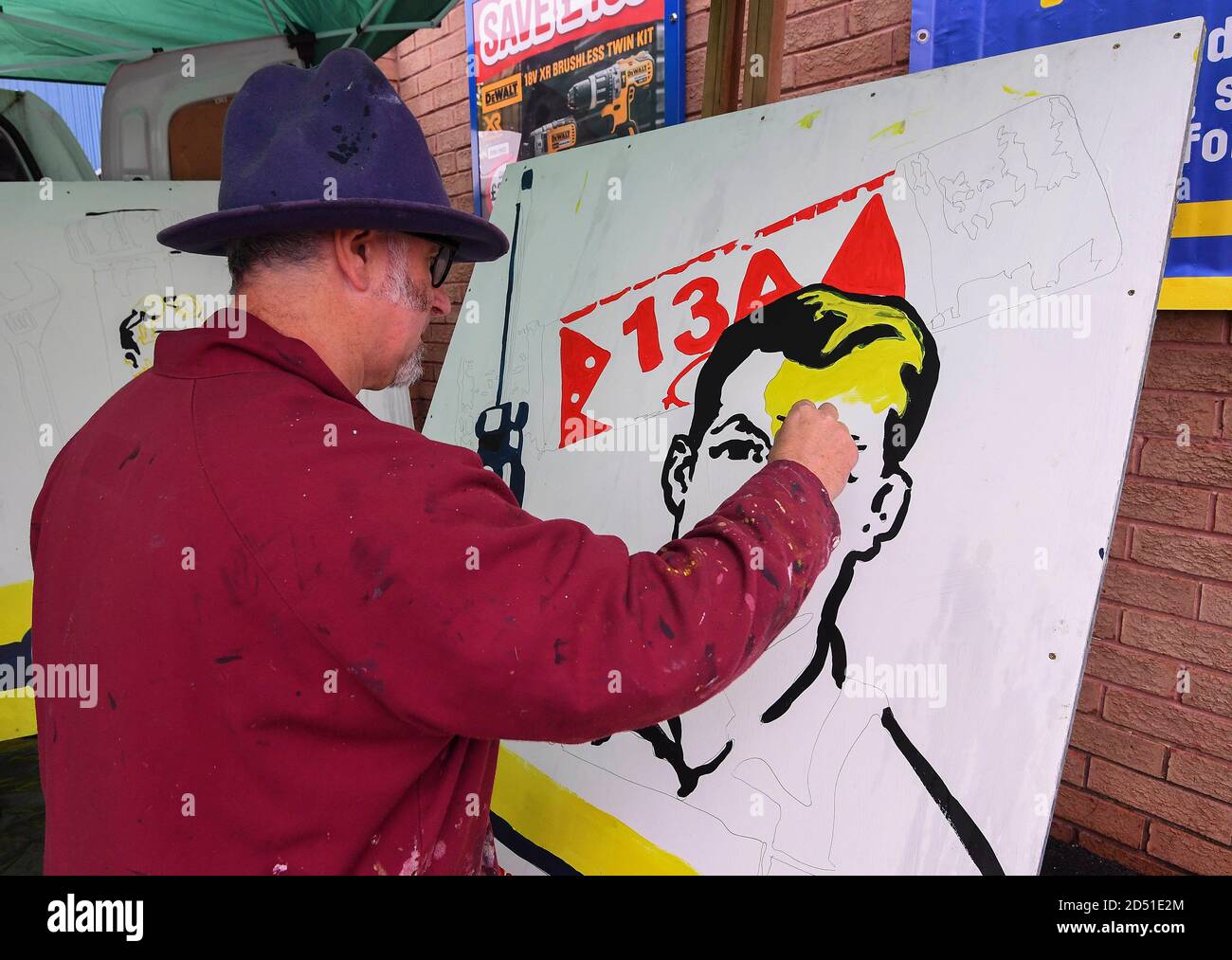 EDITORIAL USE ONLY Artist Trafford Parsons, who has previously worked and exhibited with Banksy, launches Toolstation's live art installation series celebrating the trades industry at the opening of the new Toolstation store in Pudsey, West Yorkshire. Stock Photo