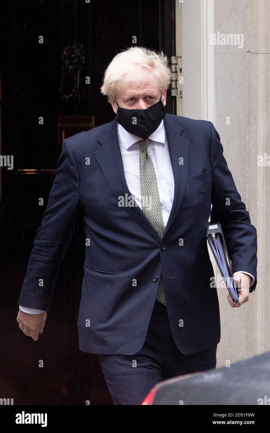 Prime Minister Boris Johnson leaves number 10 Downing Street for the Houses of Parliament on the 12th of October 2020, to give a speech on his plans Stock Photo