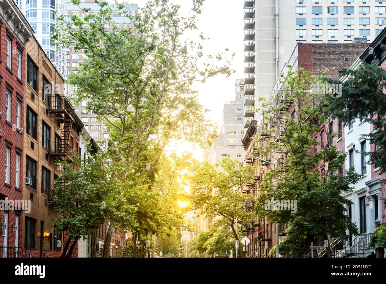 Tree lined street with historic homes in Midtown Manhattan, New York ...