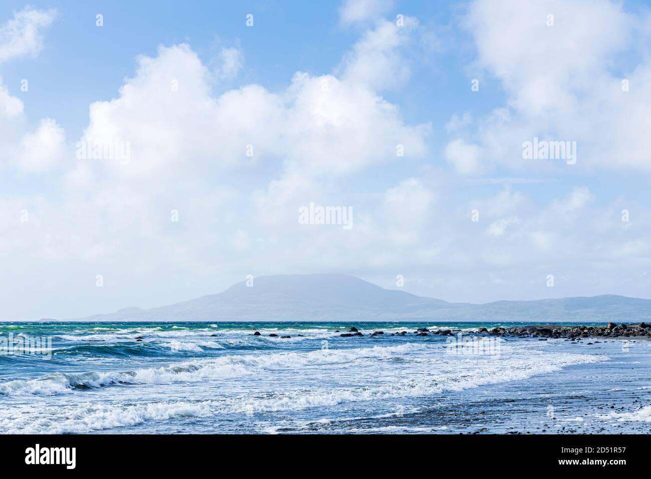 Waves rolling in to shore on a windy day in Clew bay with views to