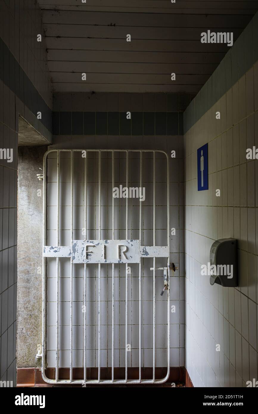 Metal bars of a door to the gents toilet, Fir in the Irish language
