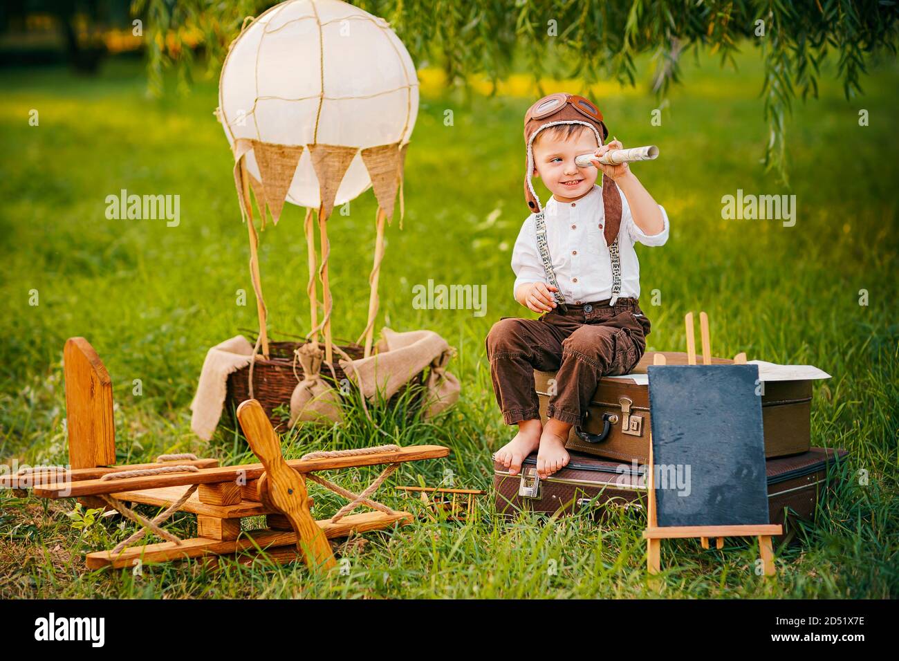A little boy dreams of a pilot. Vintage aviation hat Stock