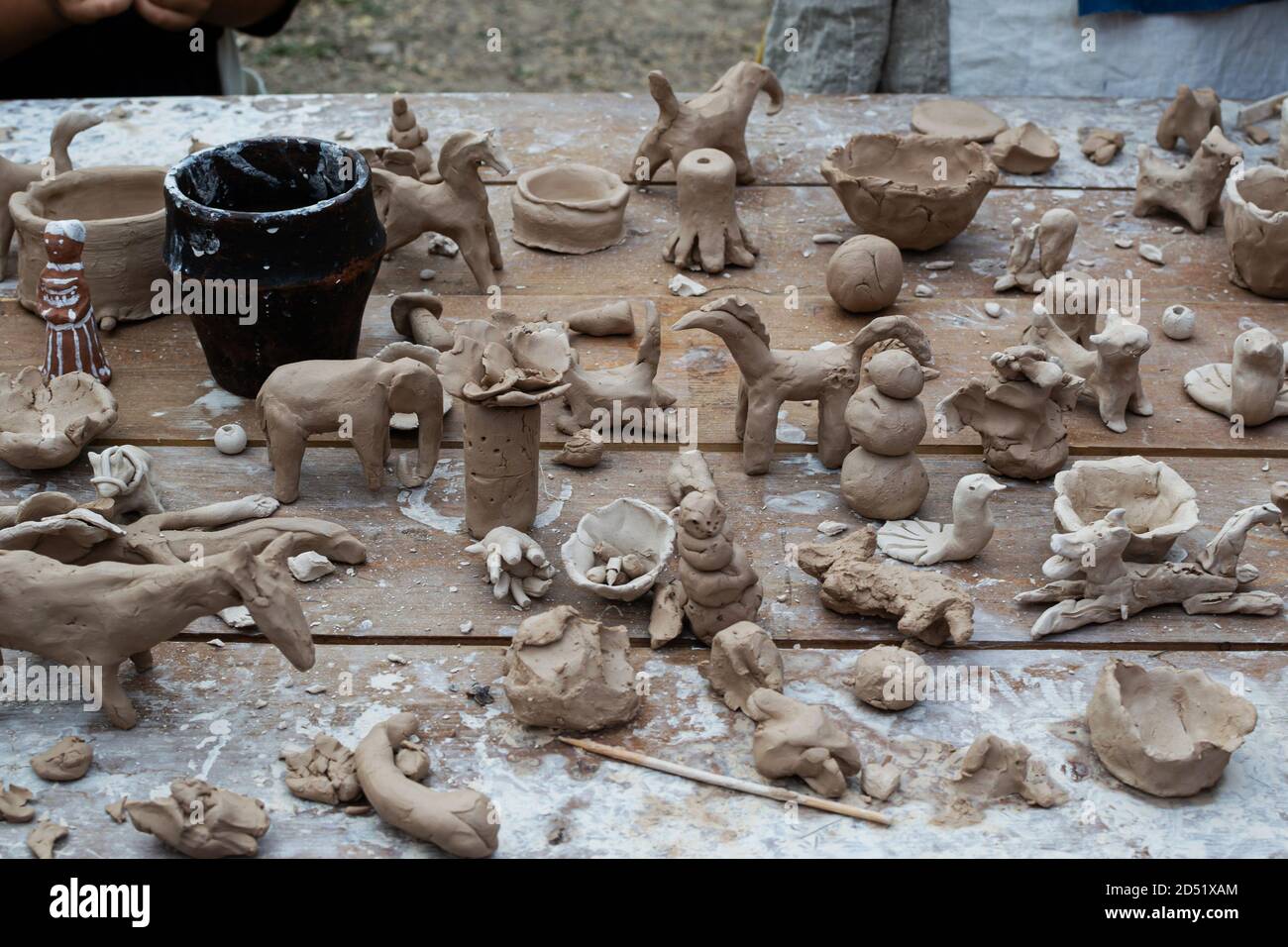 Moscow, Russia September 5, 2020. Children sculpt clay figurines in