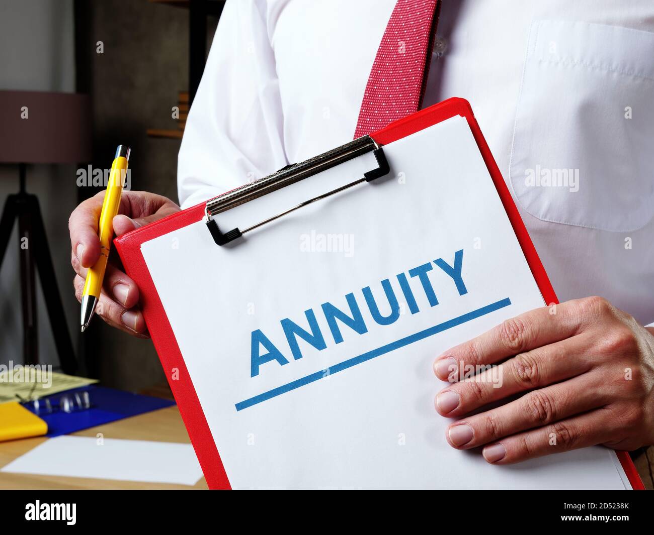 Info about Annuity and the manager offers to sign the documents. Stock Photo