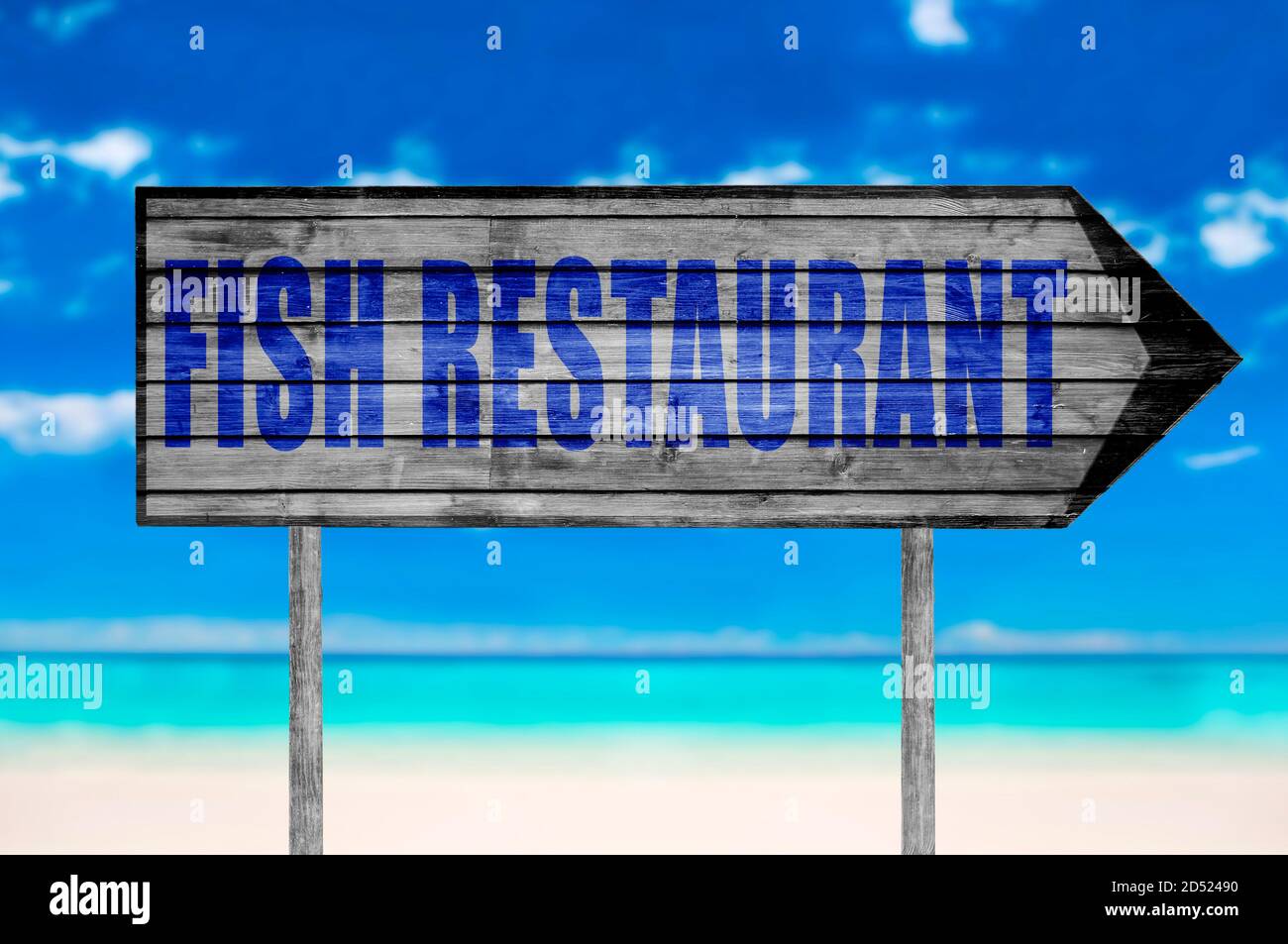 Fish Restaurant wooden sign with on a beach background Stock Photo - Alamy