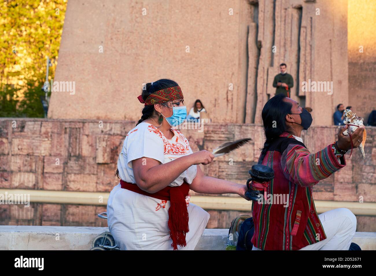 Performing a south american native purification ritual, Plaza Colon, Dia Nacional de España, Dia de la Hispanidad, protest, Madrid, Spain, October 12 Stock Photo