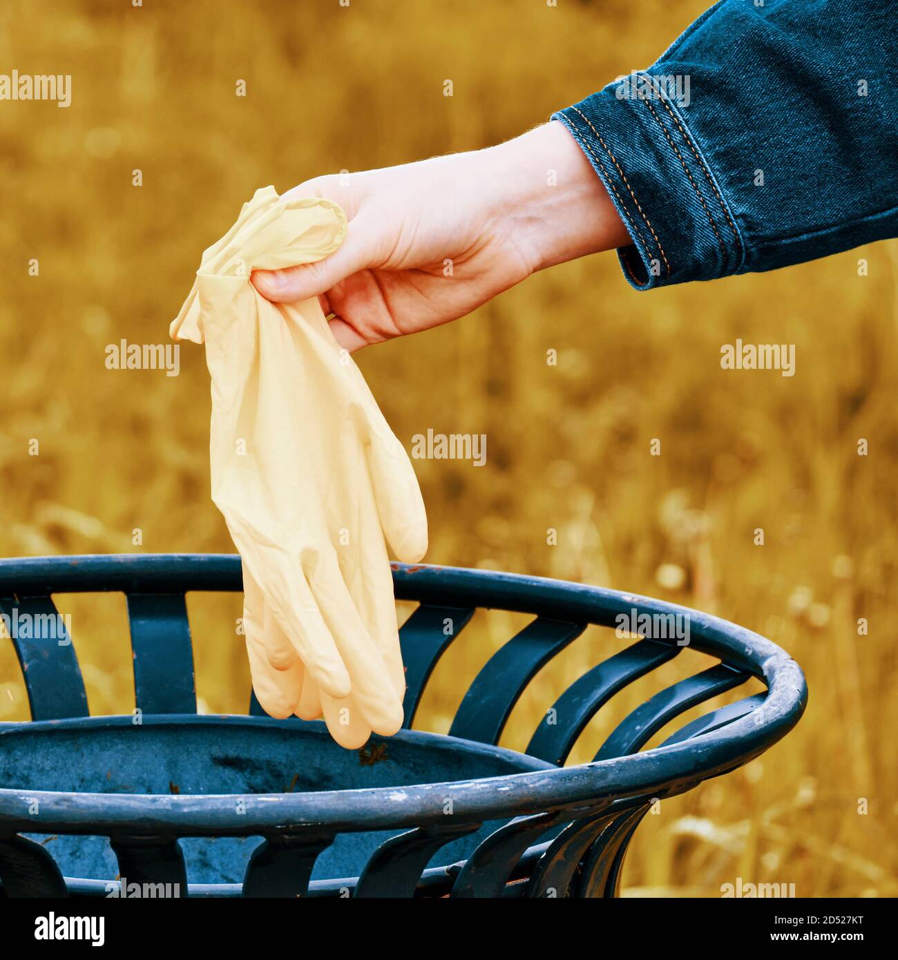 Hand throws out used latex gloves Stock Photo Alamy
