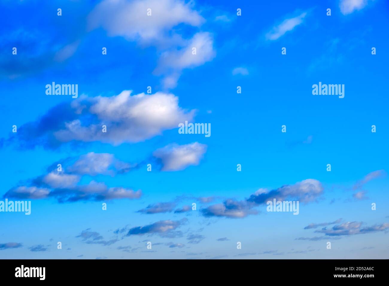 White clouds in clear spring weather, copy space. Sunny sky in the ...