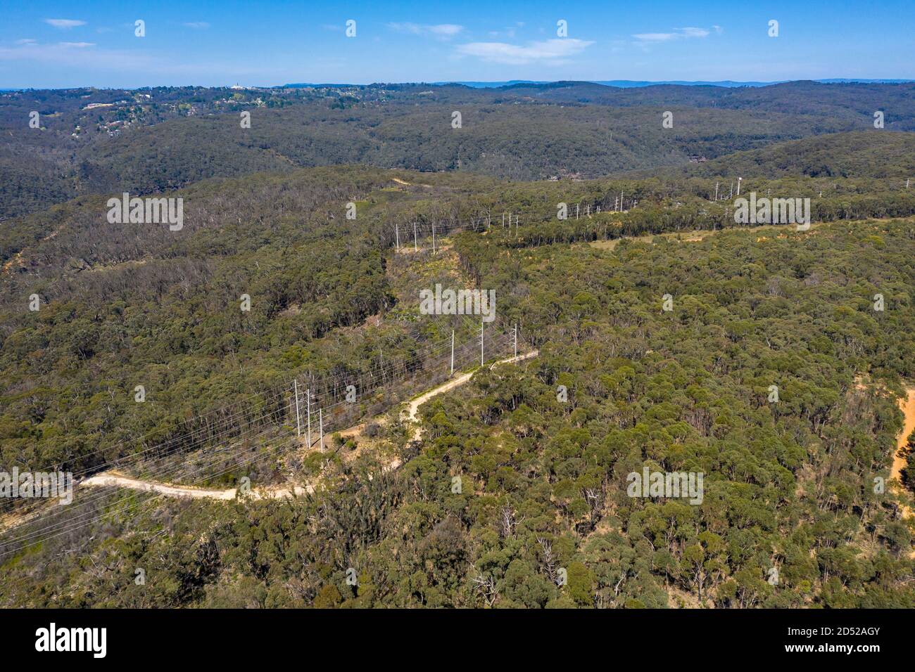 Aerial view of transmission towers and power lines running through a ...