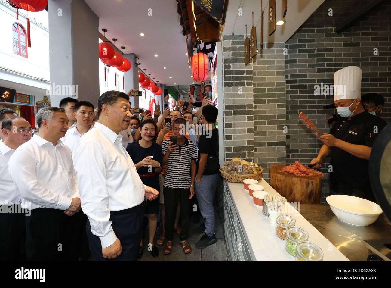 Chaozhou, China's Guangdong Province. 12th Oct, 2020. Chinese President Xi Jinping, also general secretary of the Communist Party of China Central Committee and chairman of the Central Military Commission, visits a street lined with ancient memorial archways to check the development of cultural and tourism resources in Chaozhou, south China's Guangdong Province, Oct. 12, 2020. Xi on Monday arrived in Guangdong to begin an inspection tour of the province. Credit: Ju Peng/Xinhua/Alamy Live News Stock Photo