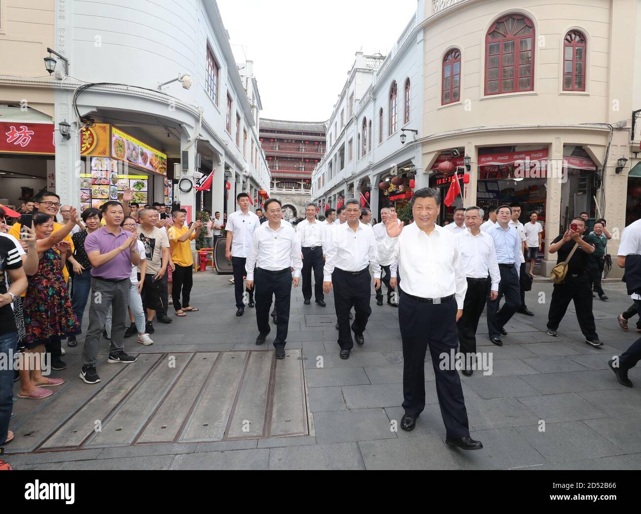Chaozhou, China's Guangdong Province. 12th Oct, 2020. Chinese President Xi Jinping, also general secretary of the Communist Party of China Central Committee and chairman of the Central Military Commission, waves to people while visiting a street lined with ancient memorial archways in Chaozhou, south China's Guangdong Province, Oct. 12, 2020. Xi on Monday arrived in Guangdong to begin an inspection tour of the province. Credit: Wang Ye/Xinhua/Alamy Live News Stock Photo
