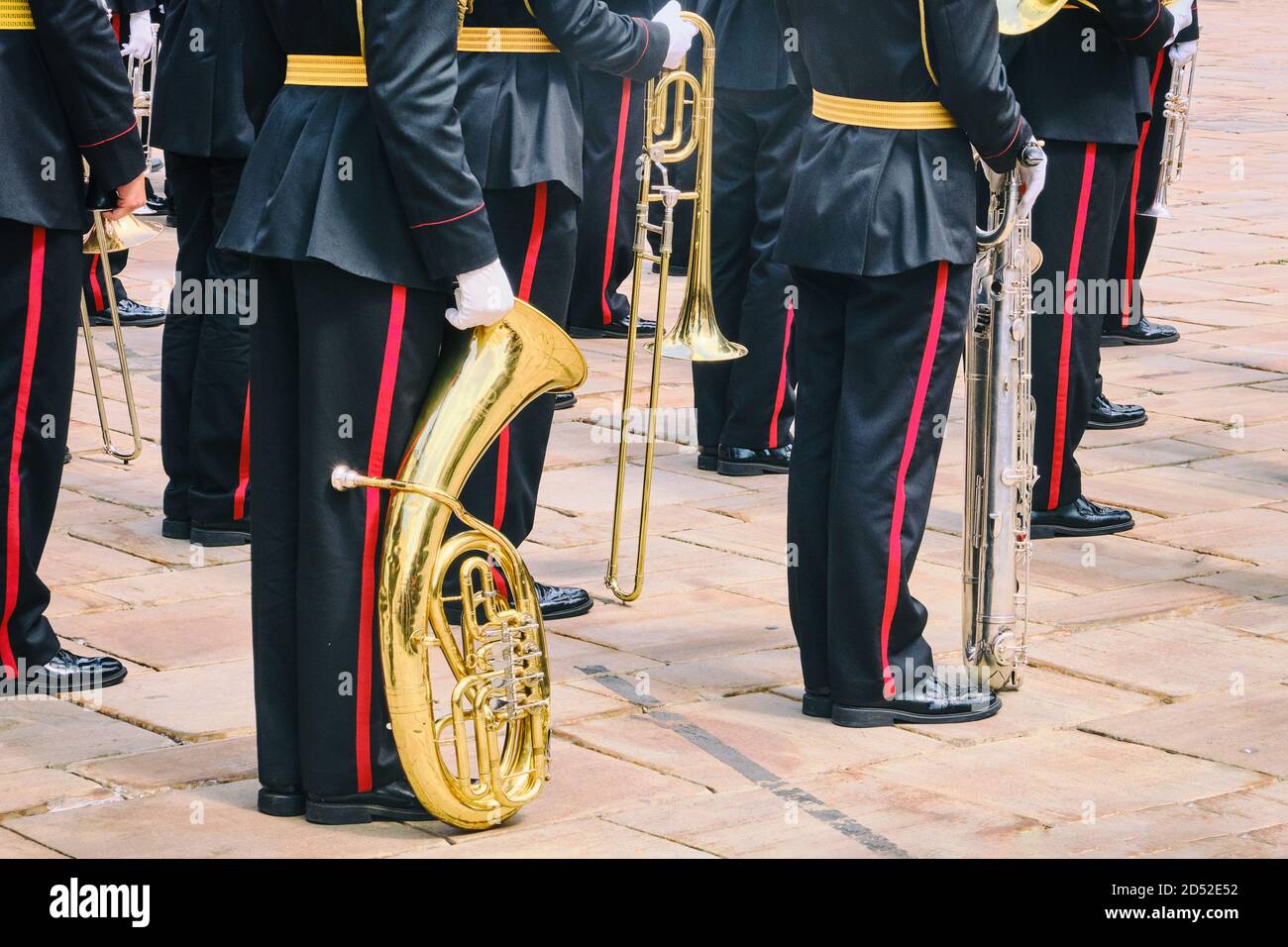 Military musicians on parade with wind instruments in their hands