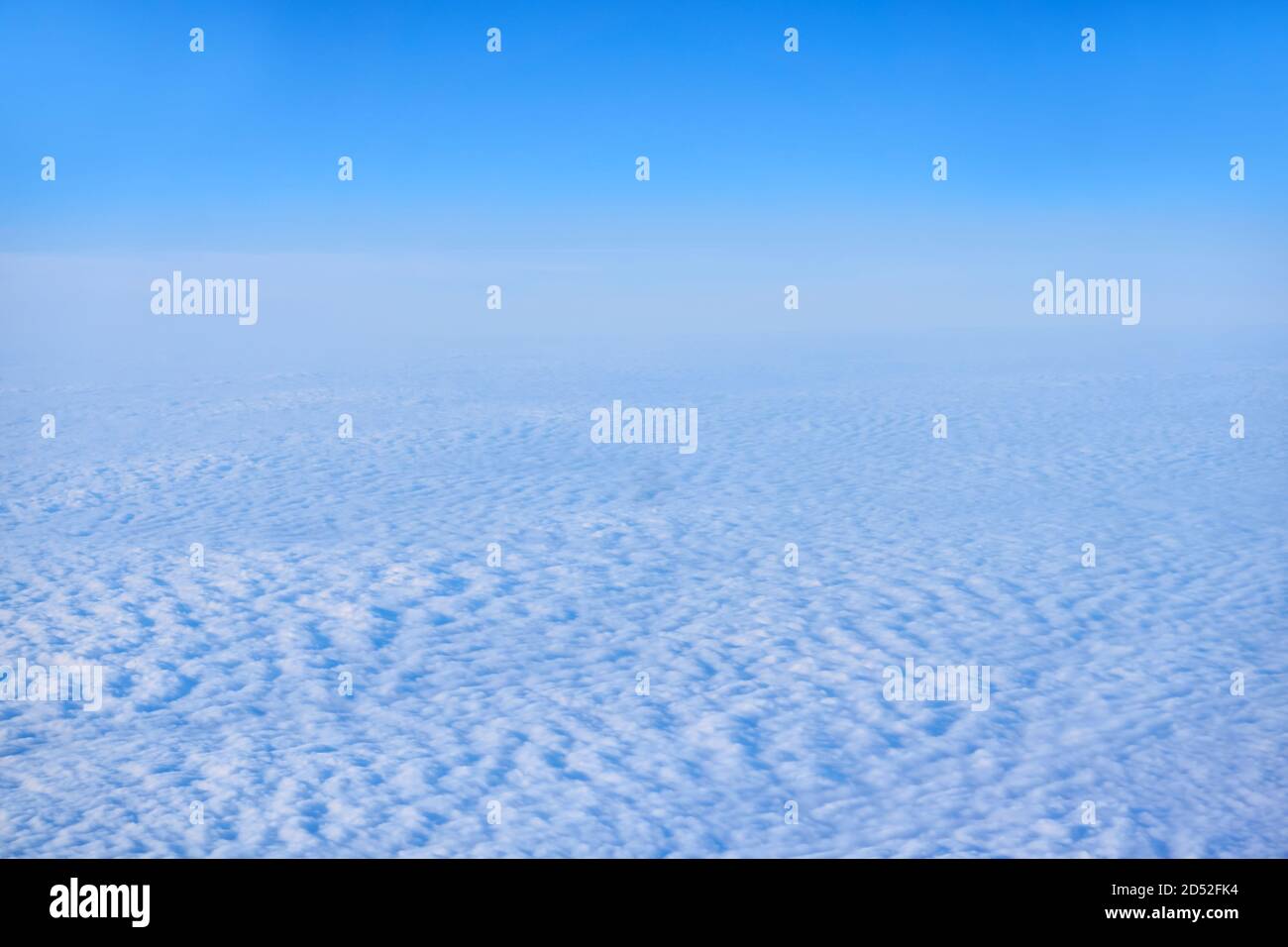 background, cloudscape - continuous cirrocumulus clouds, top view, from an airplane or from space Stock Photo