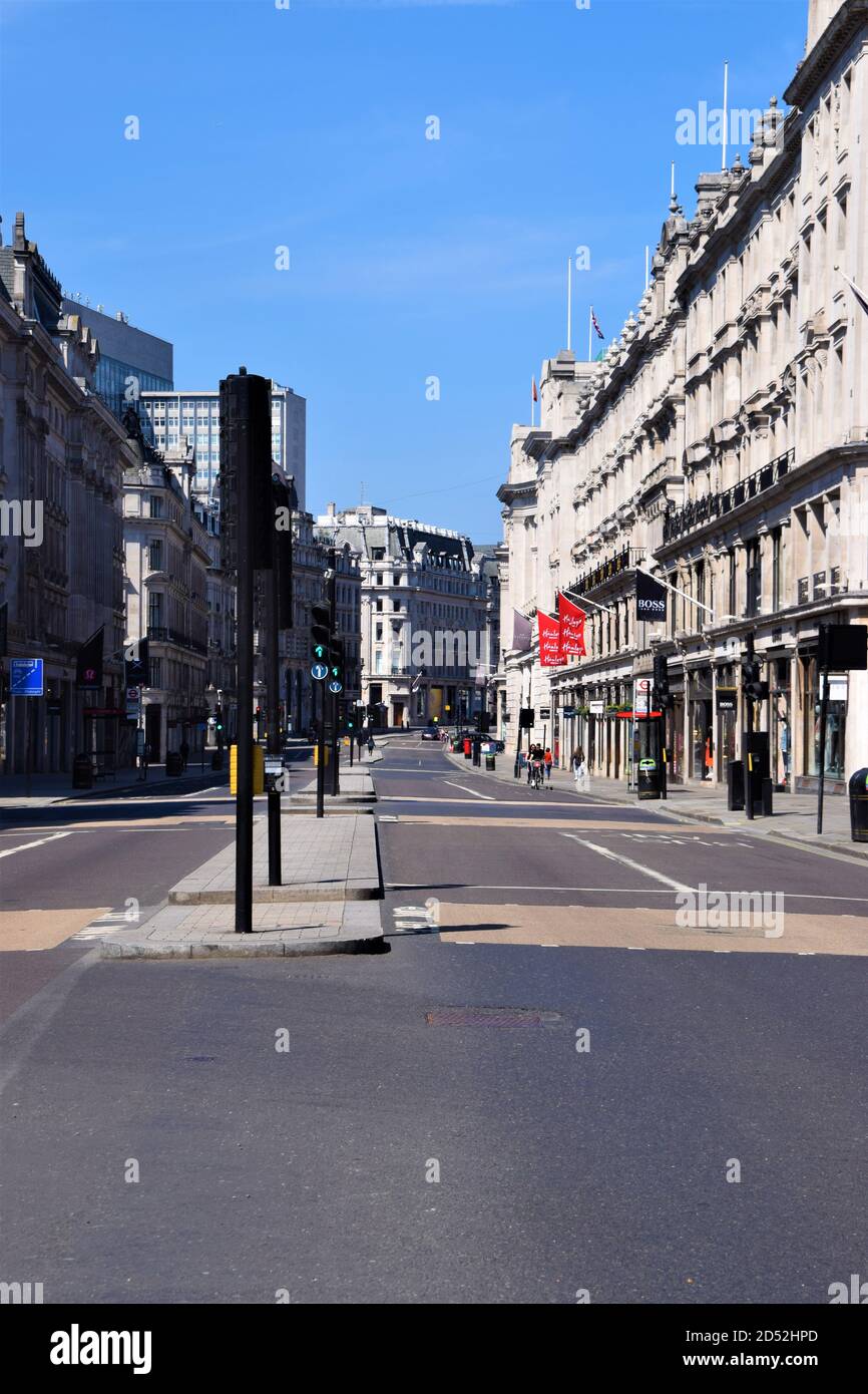 Empty Regent Street during 2020 lockdown. The usually bustling Central London resembled a ghost town as shops and businesses were closed, and people were instructed to stay at home during the coronavirus pandemic. Stock Photo
