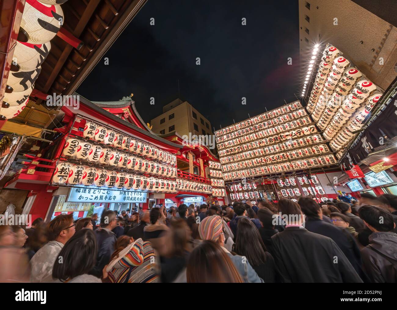 asakusa, japan - november 08 2019: Extra wide view in the Tori-no-Ichi Fair of Ootori shrine where the crowd waiting for make a wish is surrounded by Stock Photo