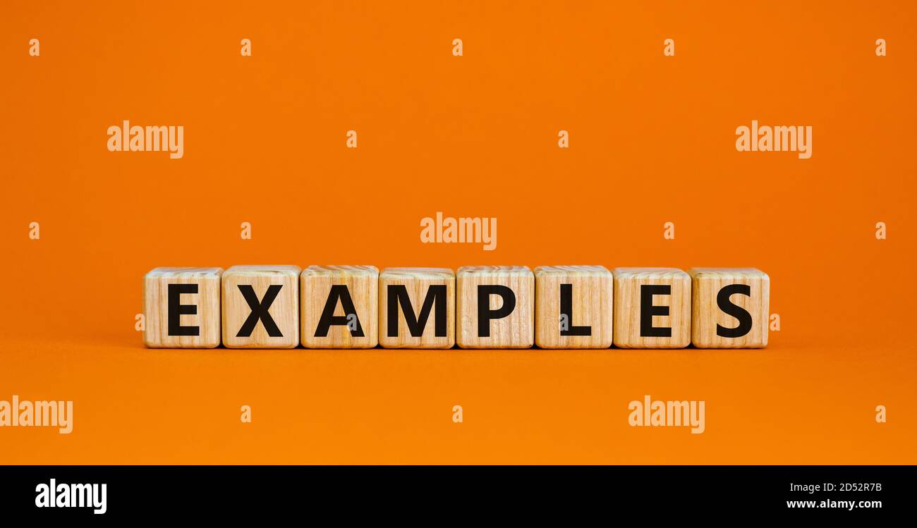 Concept word 'examples' on cubes on a beautiful orange background. Business concept. Copy space. Stock Photo