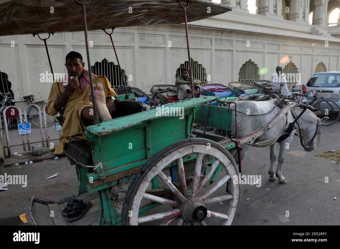 A horse cart driver sits waiting for customers near the historic Rumi