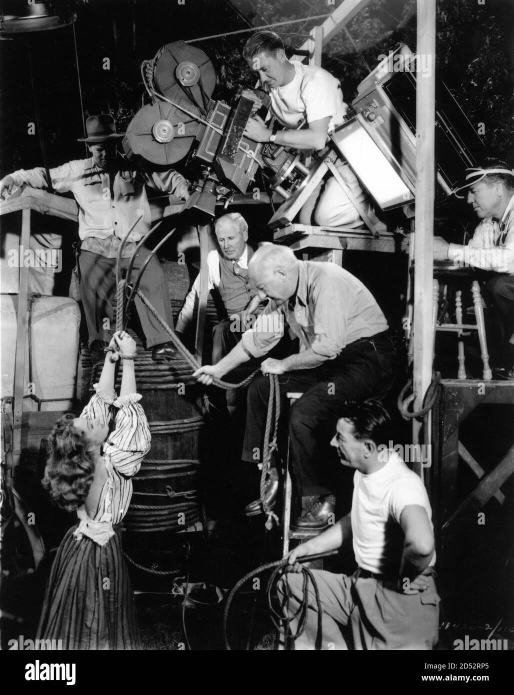 CECIL B. DeMILLE directing PAULETTE GODDARD with Cinematographer RAY RENNAHAN (with white hair) and Film Crew on set candid during filming of UNCONQUERED 1947 director CECIL B. DeMILLE  novel Neil H. Swanson music Victor Young Paramount Pictures Stock Photo