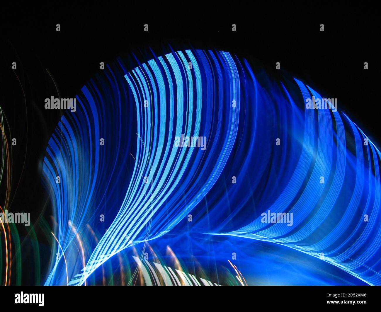 Abstract background with blue light trails on a dark background Stock ...