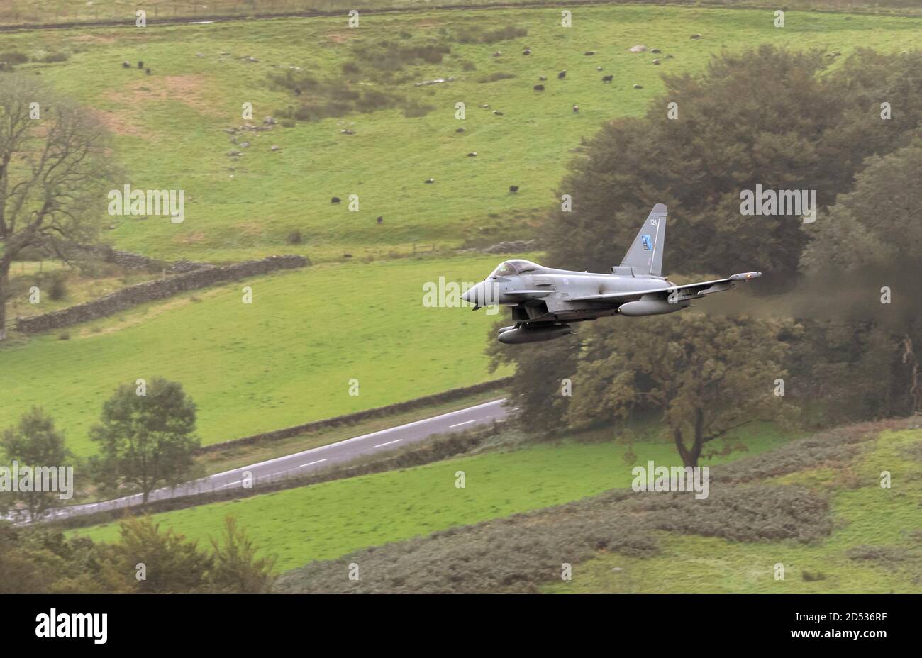 RAF Typhoon ZK324 from RAF Lossiemouth flying low level avove Thirlmere in the Lake District Stock Photo