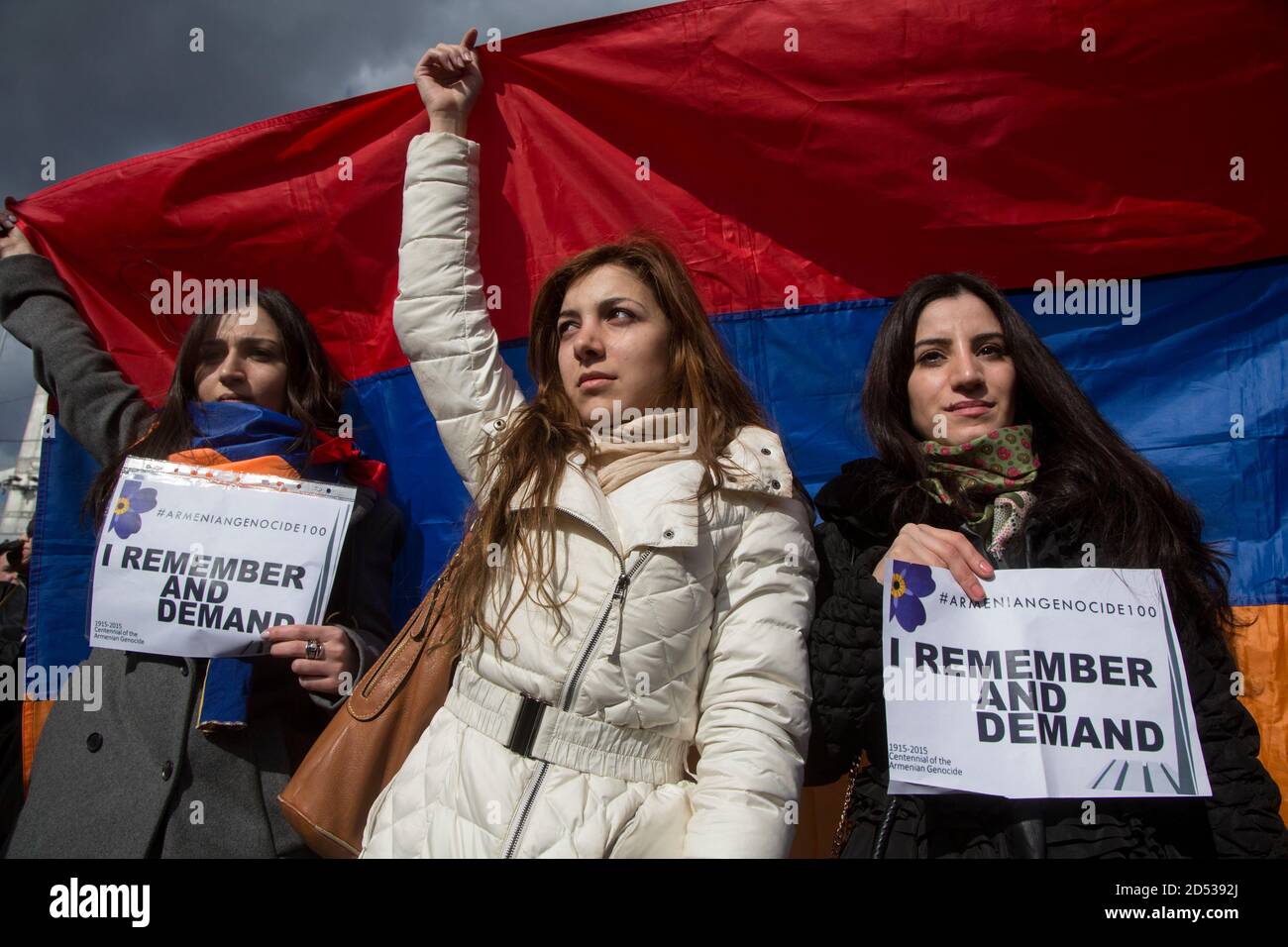 Moscow, Russia. 24th of April, 2015 Armenian girls hold the national flag of Armenia and banners during a rally on the day of remembrance of the victims of the 1915 Armenian genocide in the territory of the Ottoman Empire, in Gorky Park in Moscow, Russia Stock Photo