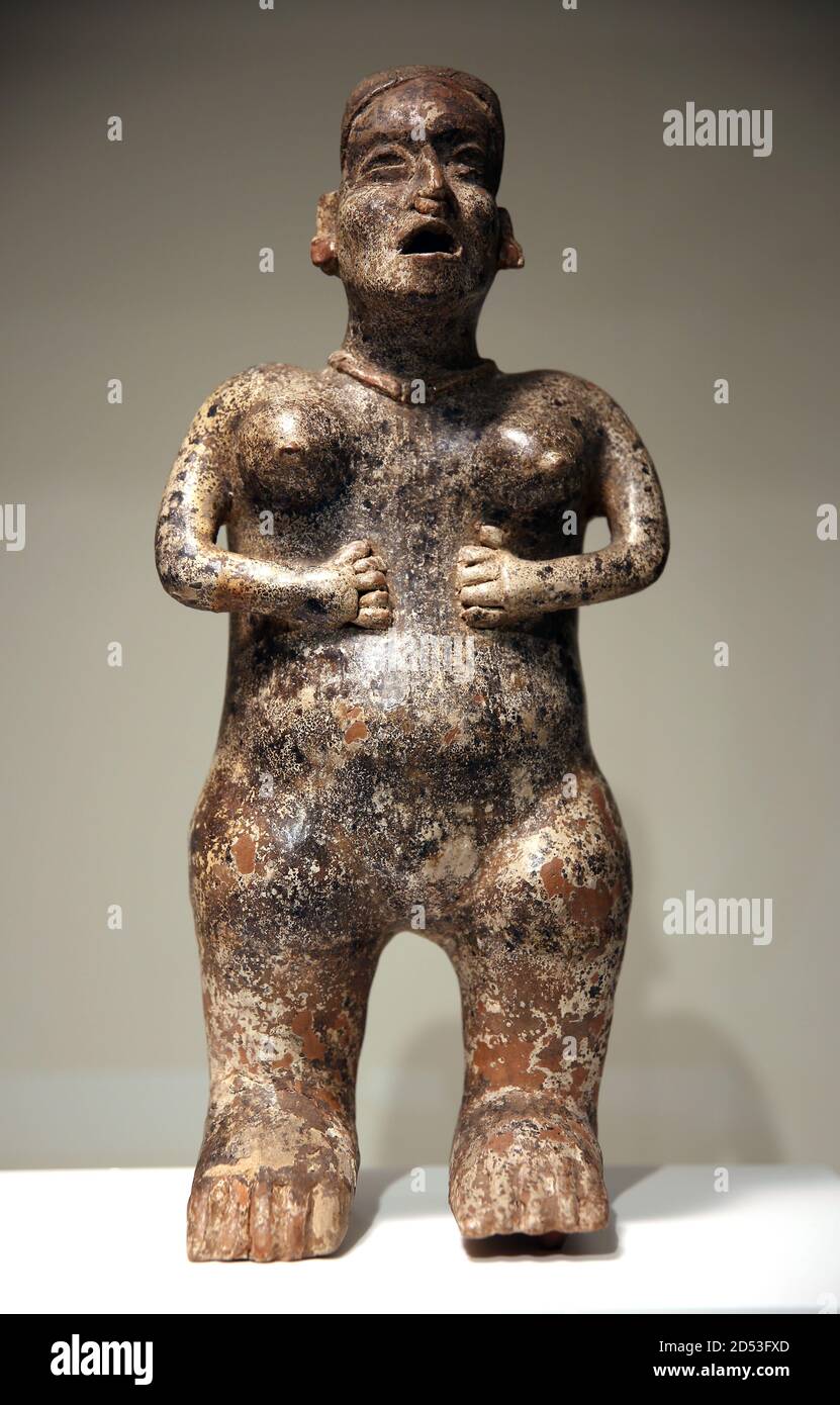 Female standing figure. Burnished ceramic (200 BC-400AD). Jalisco, Mexico. Sant Sebastian style. World Cultures Museum, Barcelona, Spain. Stock Photo