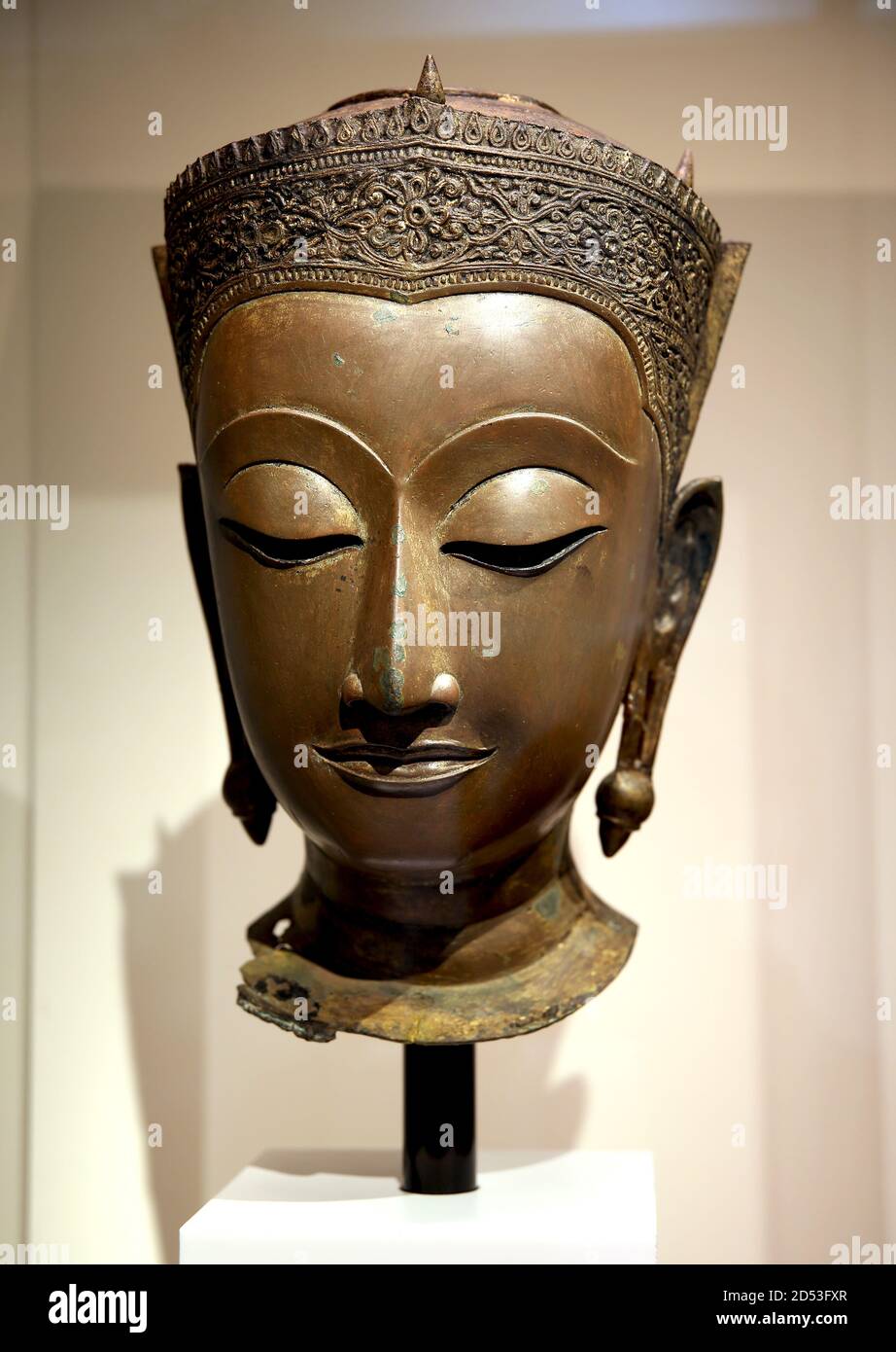 Head of a crowned Buddha. 18th century. Bronze. Ayutthaya. Thai art. Thailand. Museum of World Cultures Barcelona, Catalonia. Spain. Stock Photo