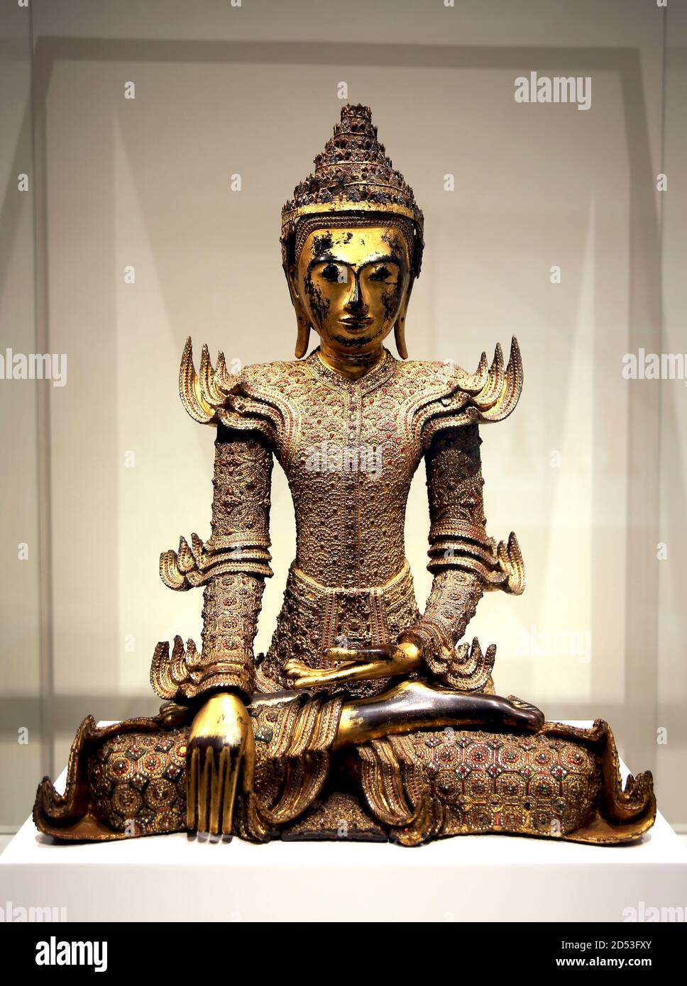 Crowned Buddha statue. 19th cent. Burma ( Myanmar). Gold lacquered wood with glass inlay. Museum of World Cultures. Barcelona. Spain. Stock Photo