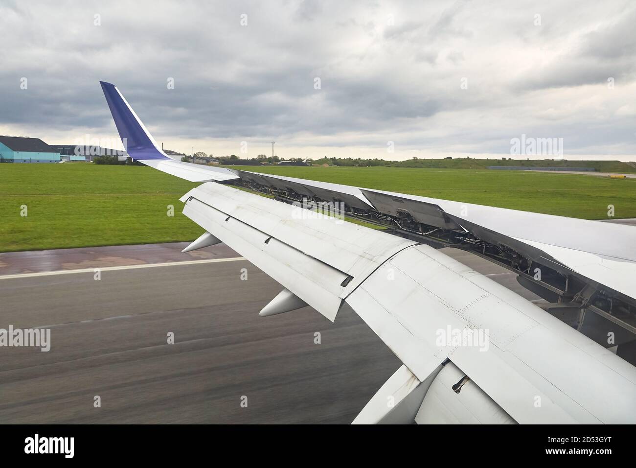 Landing plane wing flaps and spoilers extended Stock Photo