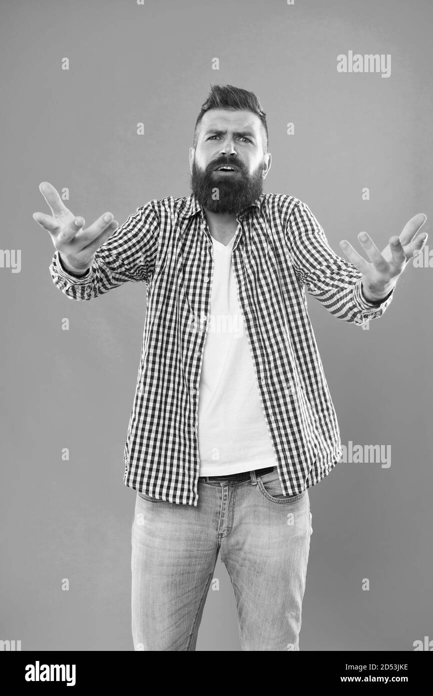 Who are you. Depreciation and neglect. Disregard and disrespect. Bearded hipster brutal person. Bully hipster concept. Arrogant rude hipster man. Communication and gesturing. Expressive manners. Stock Photo