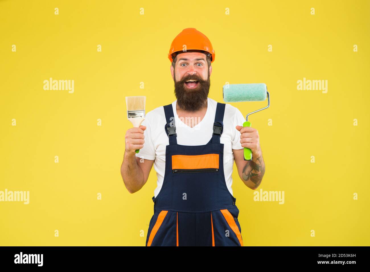 Moments of best creation. Happy decorator yellow background. Painter  decorator hold paint roller and brush. Handyman or worker. Painting and  decorating work. Design and decor. Renovation and repair Stock Photo - Alamy