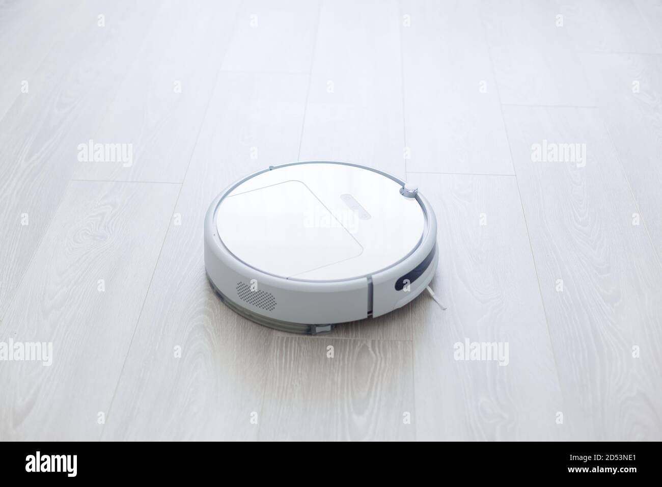 robotic vacuum cleaner on laminate wood floor smart cleaning technology